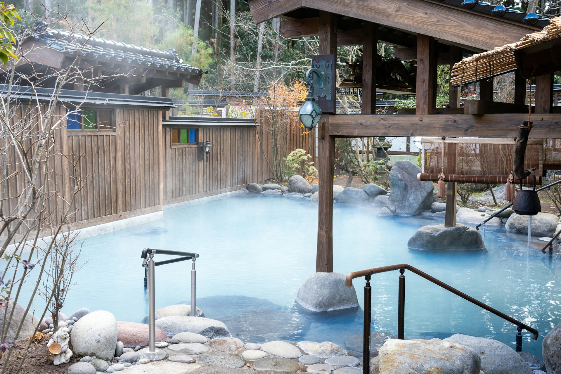 A traditional ryokan open-air onsen bath in winter